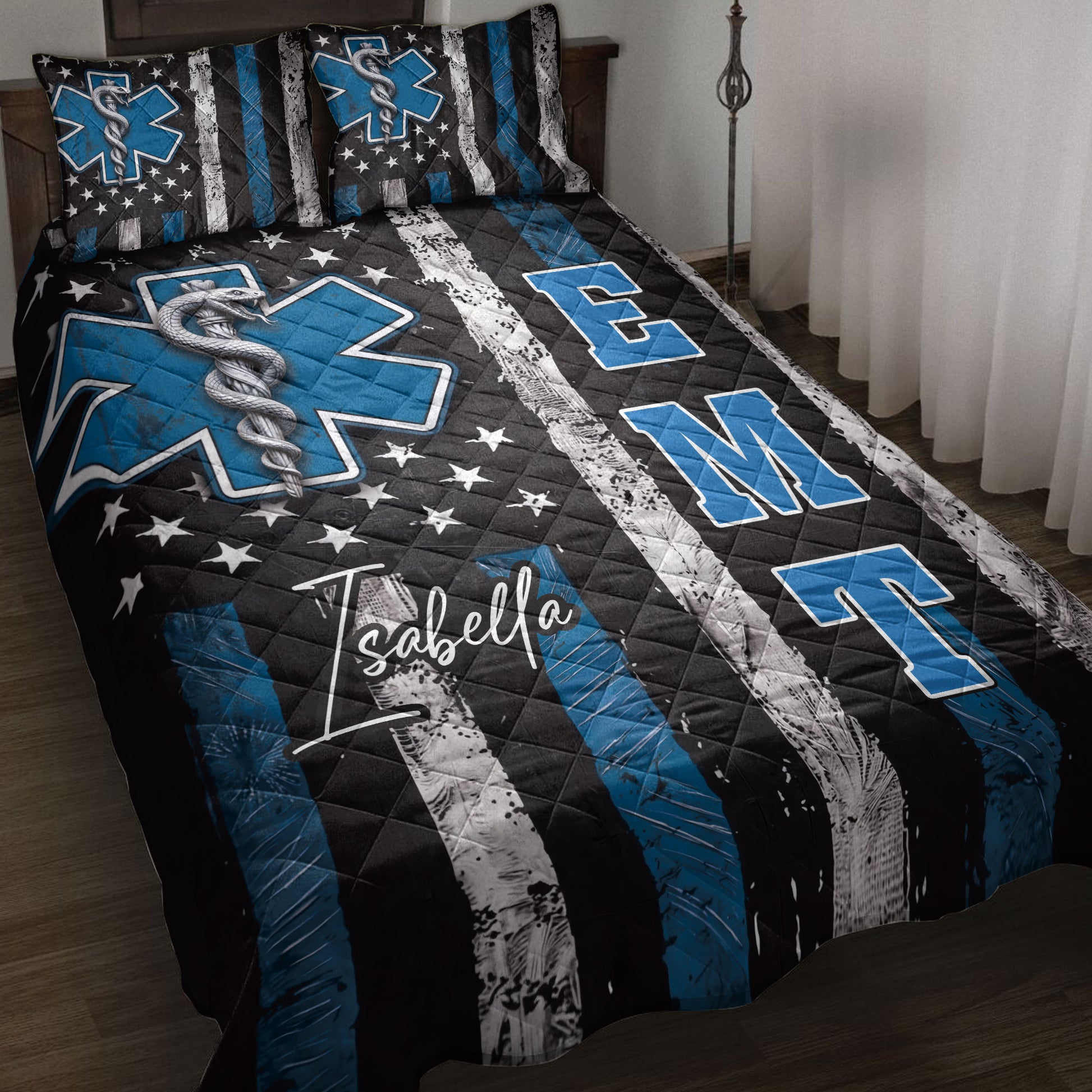 Paramedic quilt blanket displayed on a bed with blue Star of Life symbols, medical caduceus artwork, and stars