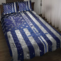 Paramedic quilt blanket bedding set displayed on a bed with navy blue stars, medical star emblems, and silver stripes