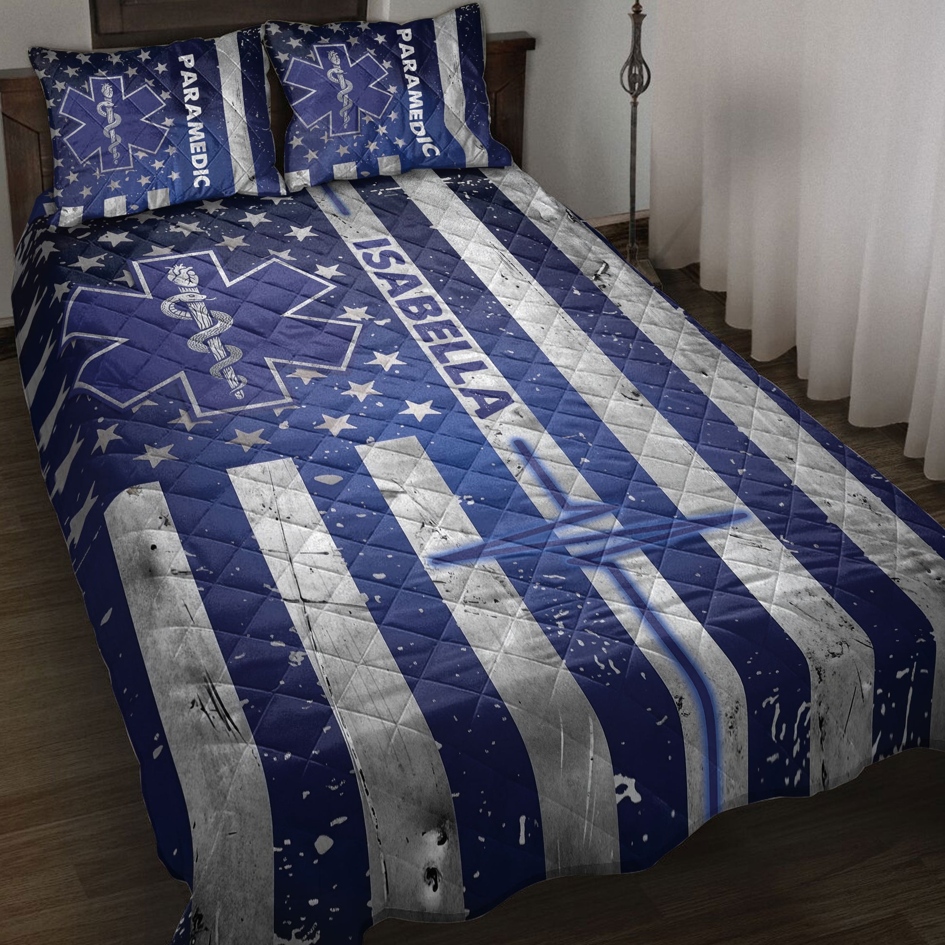 Paramedic quilt blanket bedding set displayed on a bed with navy blue stars, medical star emblems, and silver stripes