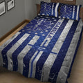 Navy paramedic quilt blanket displayed on a bedroom bed with stars, medical emblems, and bold silver stripes