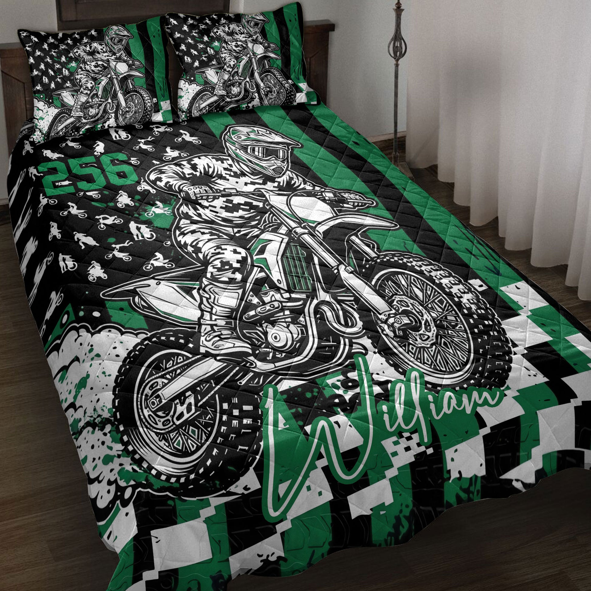Motocross quilt bedding set displayed on a bed with dirt bike rider artwork in black and green
