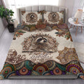 Raccoon quilt bedding styled in a bright bedroom with a large woodland animal design and vibrant mandala border
