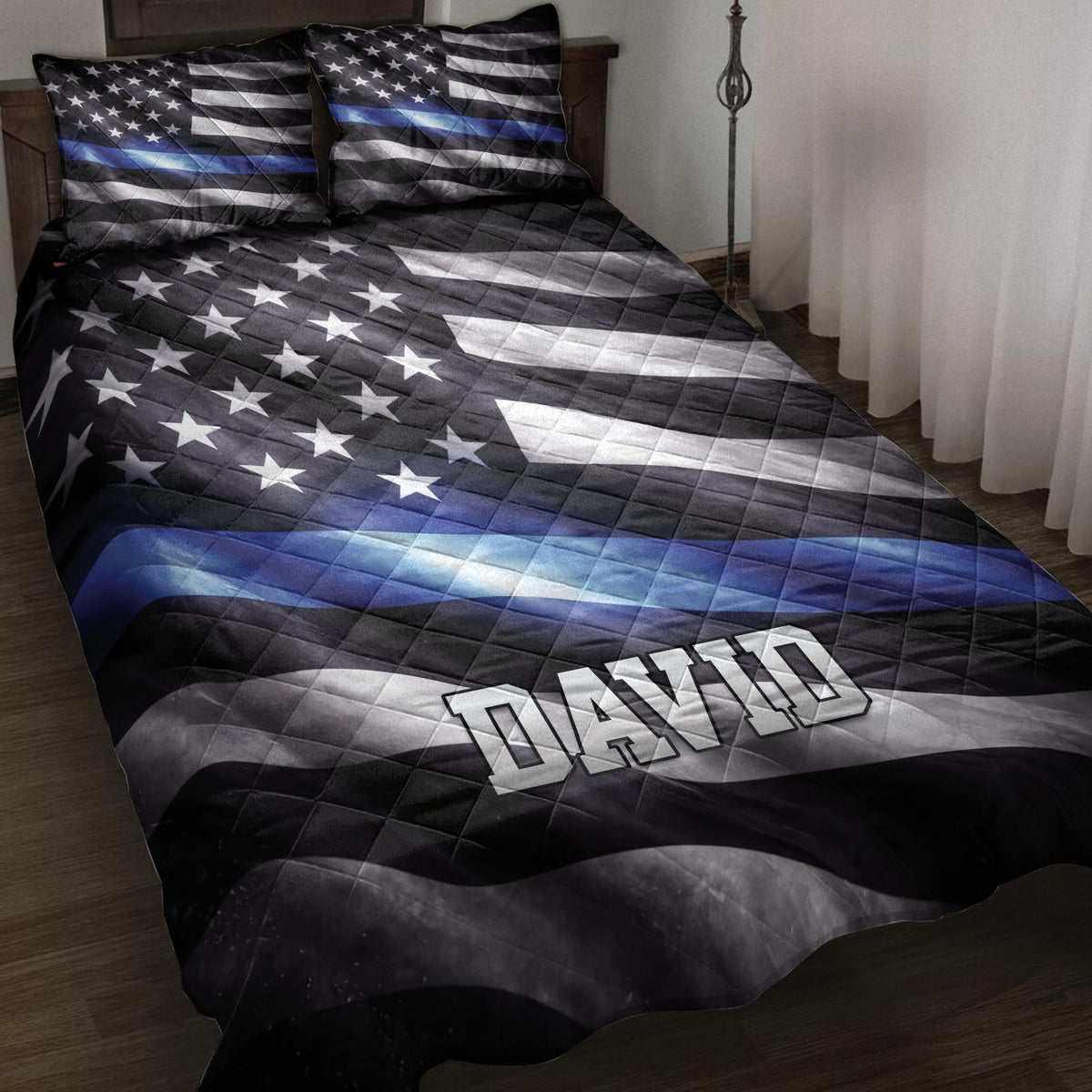 Police quilt blanket displayed on a bed with a black, white, and blue thin blue line flag design