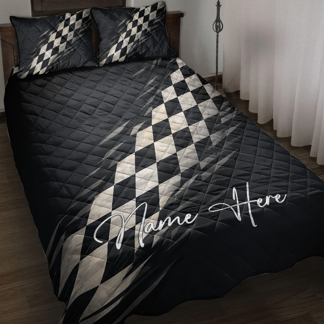 Black racing quilt blanket bedding set with checkered flag artwork on a bedroom bed