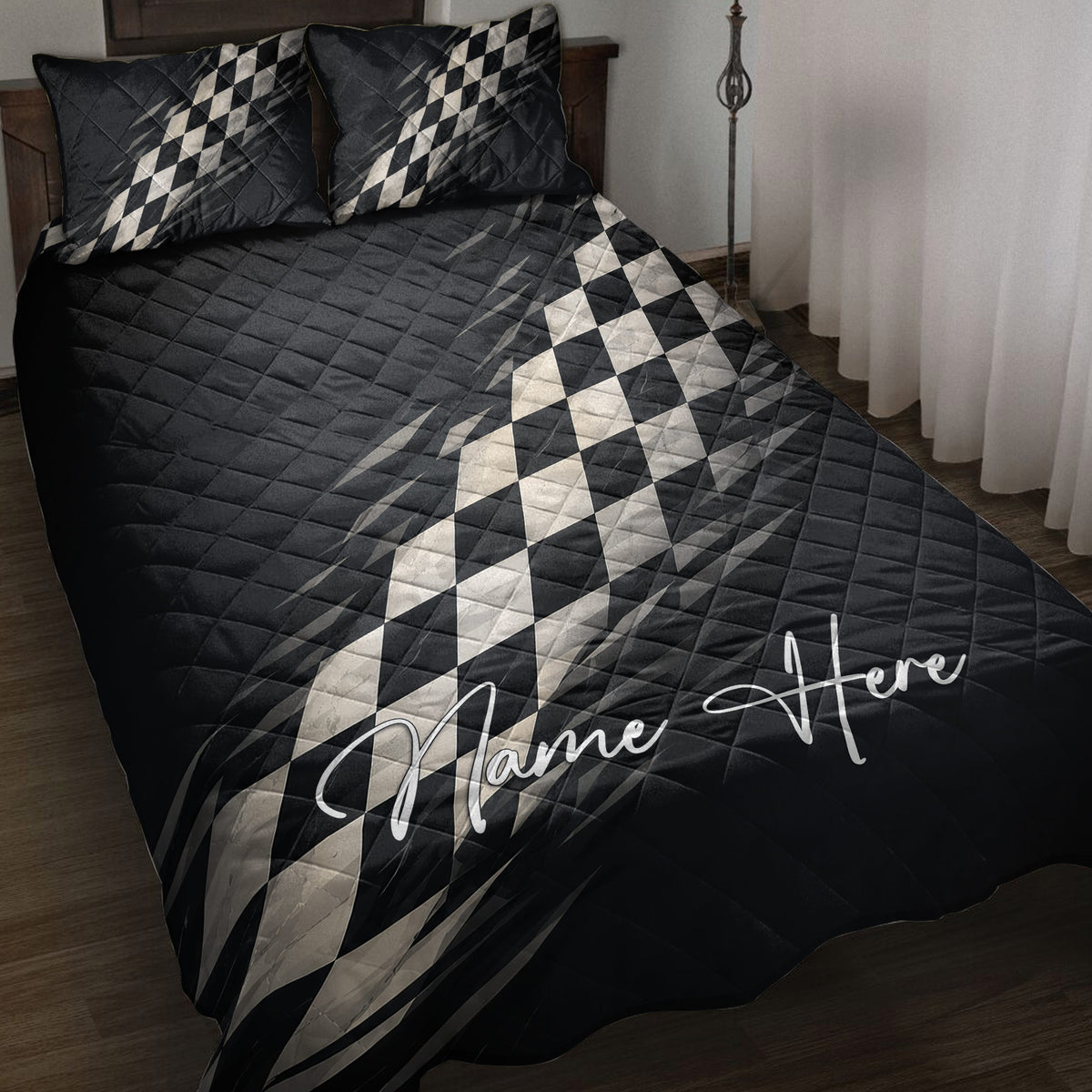 Black racing quilt blanket bedding set with checkered flag artwork on a bedroom bed