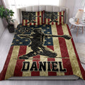 Patriotic baseball quilt bedding styled in a bright bedroom with player artwork and red, white, and blue stripes