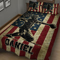 Baseball quilt blanket shown from an angled bedroom view with large player artwork, stars, and patriotic stripes