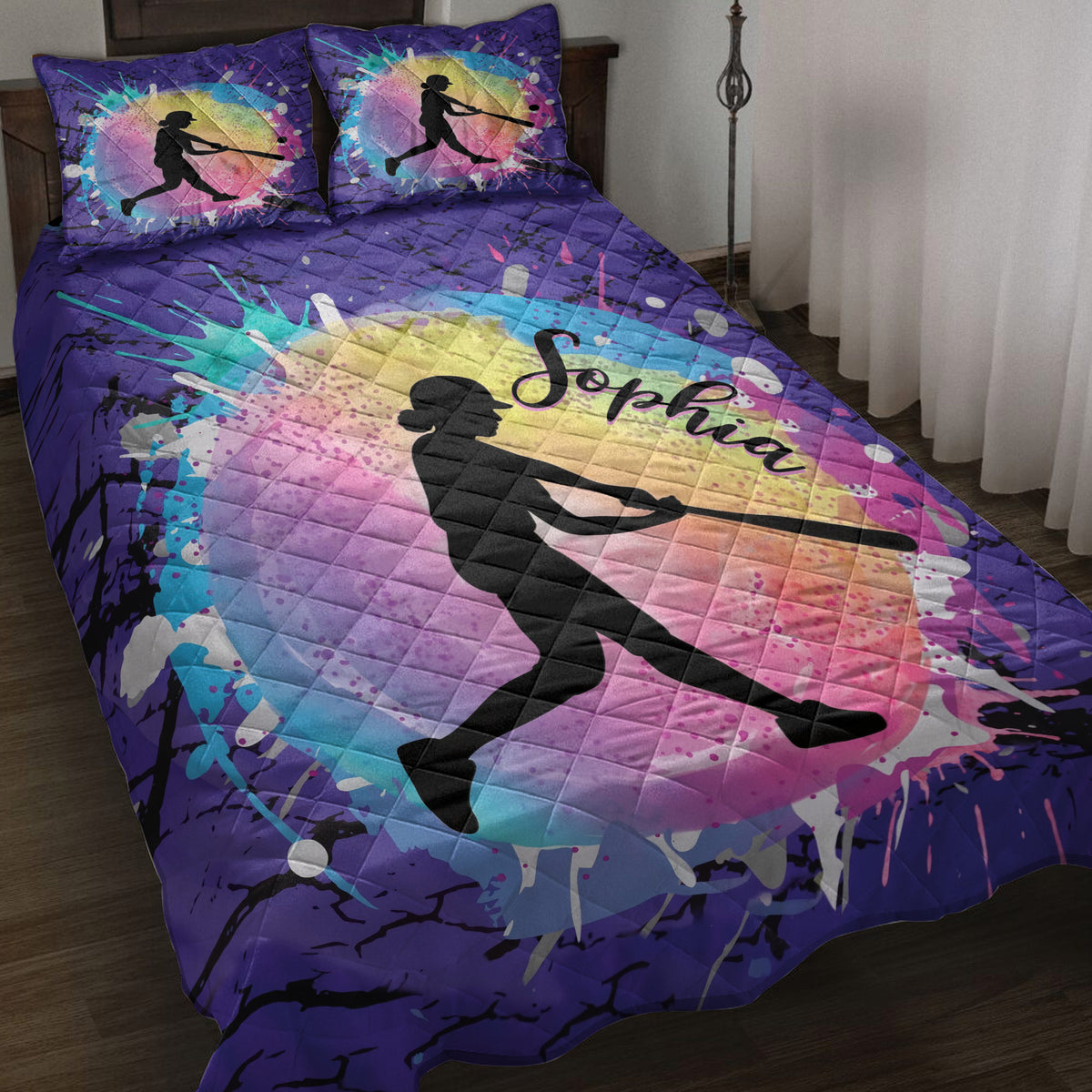 Purple softball quilt blanket featuring a female batter silhouette over vibrant rainbow splatter artwork