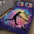 Close-up view of purple softball quilt blanket with vibrant rainbow artwork and female batter silhouette