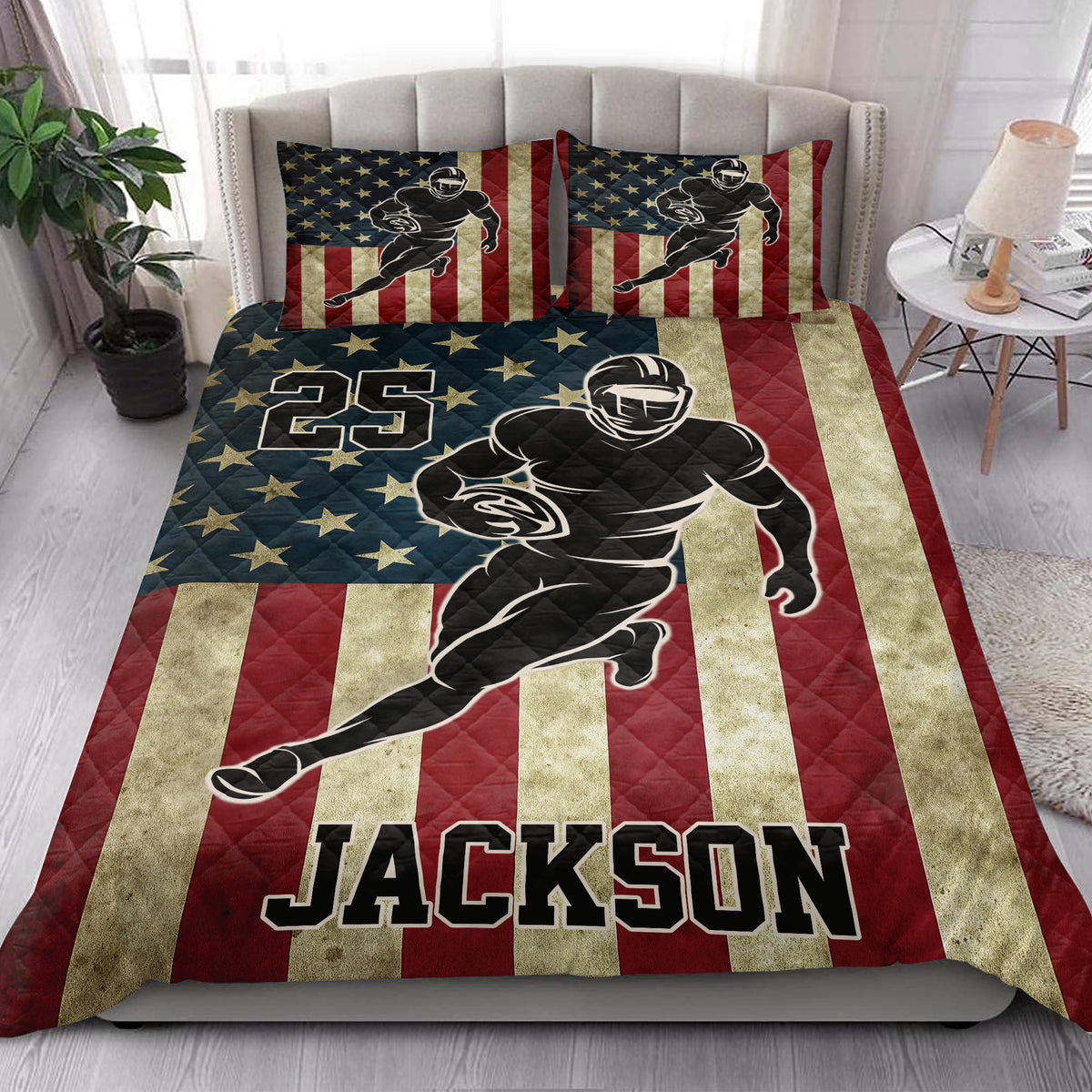 Patriotic football quilt blanket styled on a bed with stars, stripes, and bold running player artwork