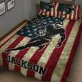 Close bedroom view of a football quilt blanket with star pattern, flag stripes, and athletic player artwork