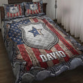 Police quilt blanket displayed on a bed with badge artwork, stars, and distressed patriotic stripes