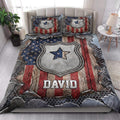 Police quilt bedding set styled in a bright bedroom with badge artwork and patriotic red, white, and blue colors
