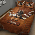 Close bedroom view of a German Shepherd quilt blanket with puppy artwork, daisies, and brown patchwork design