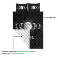 Wicca moon phase quilt shown with its printed black side and contrasting white reverse