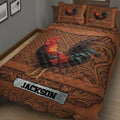 Close bedroom view of a rooster quilt blanket featuring detailed feathers, warm brown tones, and decorative flourishes