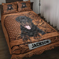 Rottweiler quilt blanket displayed on a bed with ornate brown floral and woven-pattern artwork