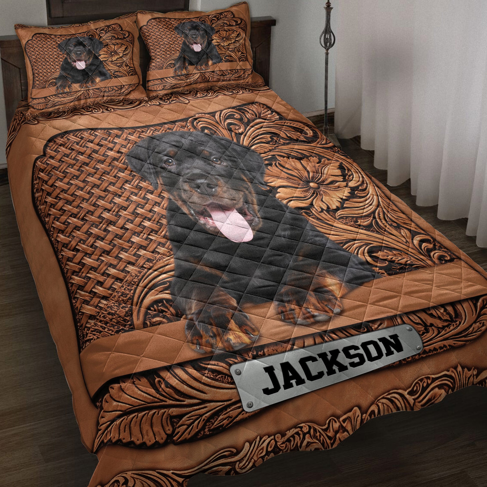 Rottweiler quilt blanket displayed on a bed with ornate brown floral and woven-pattern artwork