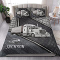 Trucker quilt blanket styled on a bedroom bed with large semi-truck artwork