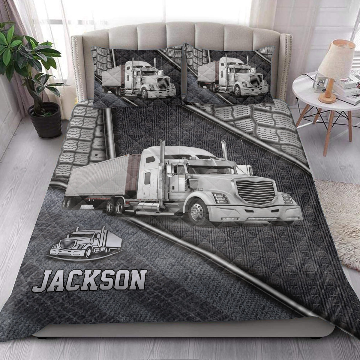 Trucker quilt blanket styled on a bedroom bed with large semi-truck artwork