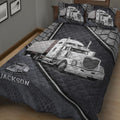 Dark gray trucker quilt bedding displayed on a bed with detailed semi-truck illustrations