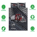 Trucking quilt bedding set shown with red semi-truck artwork, dark textured quilting, and coordinating pillows