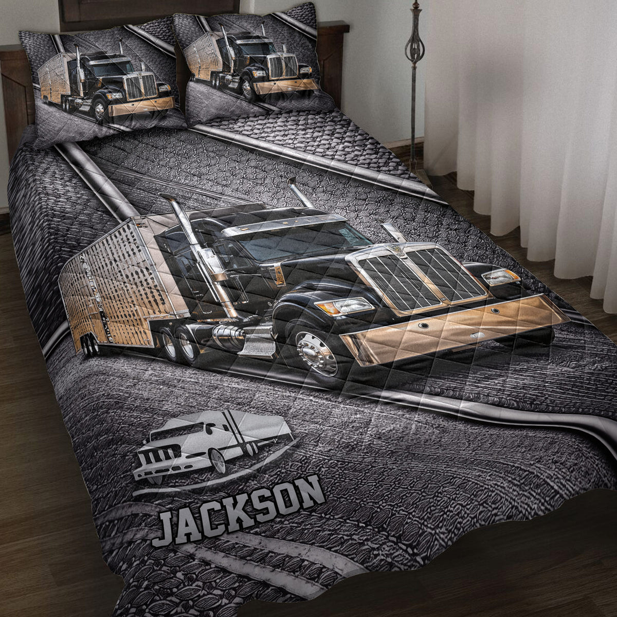 Trucker quilt blanket displayed on a bed with black and gold semi-truck artwork
