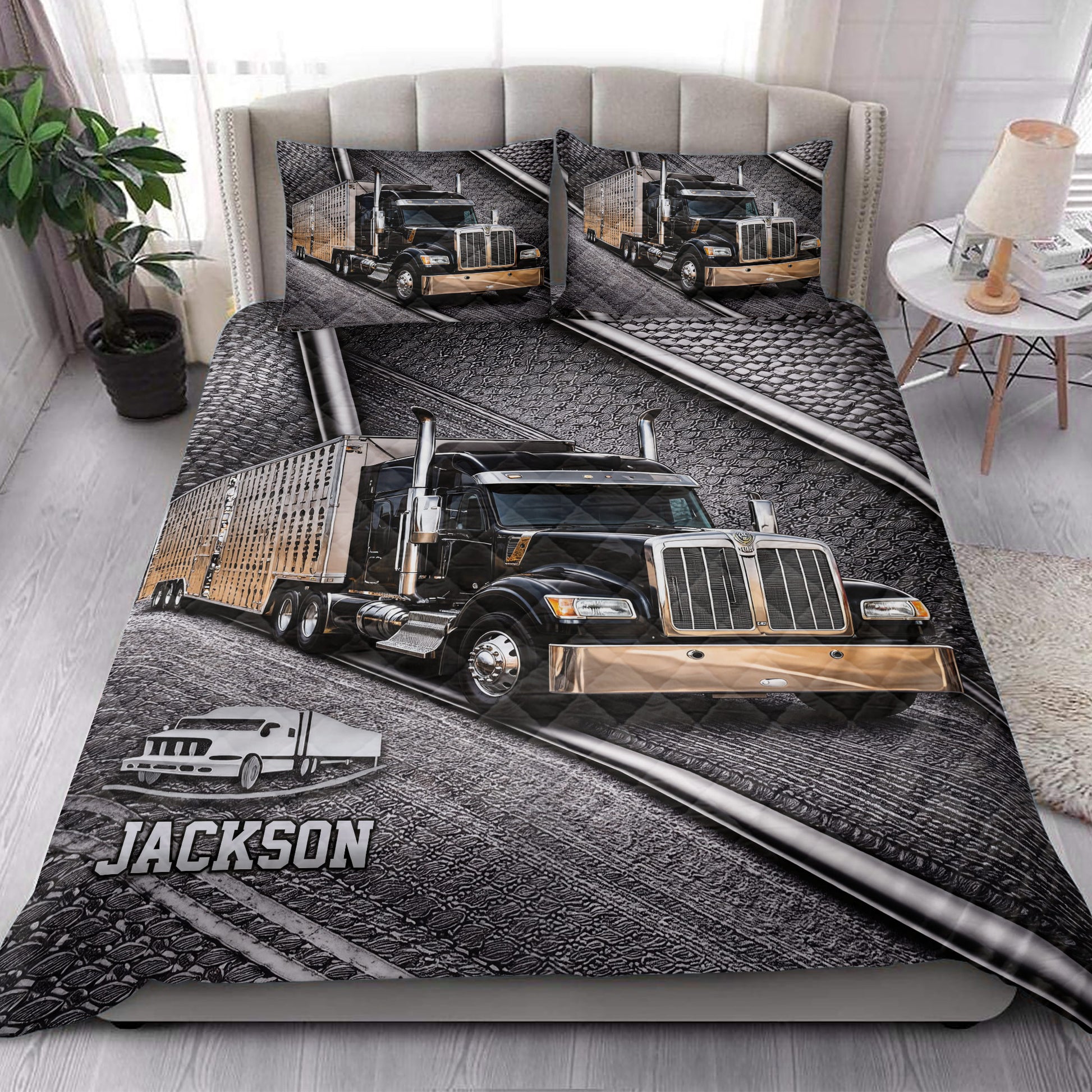 Trucker quilt bedding styled in a bedroom with bold black and gold semi-truck artwork