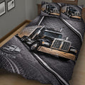 Close bedroom view of a trucker quilt blanket featuring large semi-truck artwork
