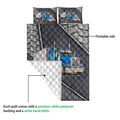 Trucker quilt showing a blue semi truck design, printed front, and light quilted reverse