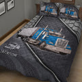 Close bedroom view of a trucker quilt blanket with blue semi truck artwork and matching truck-themed pillowcases