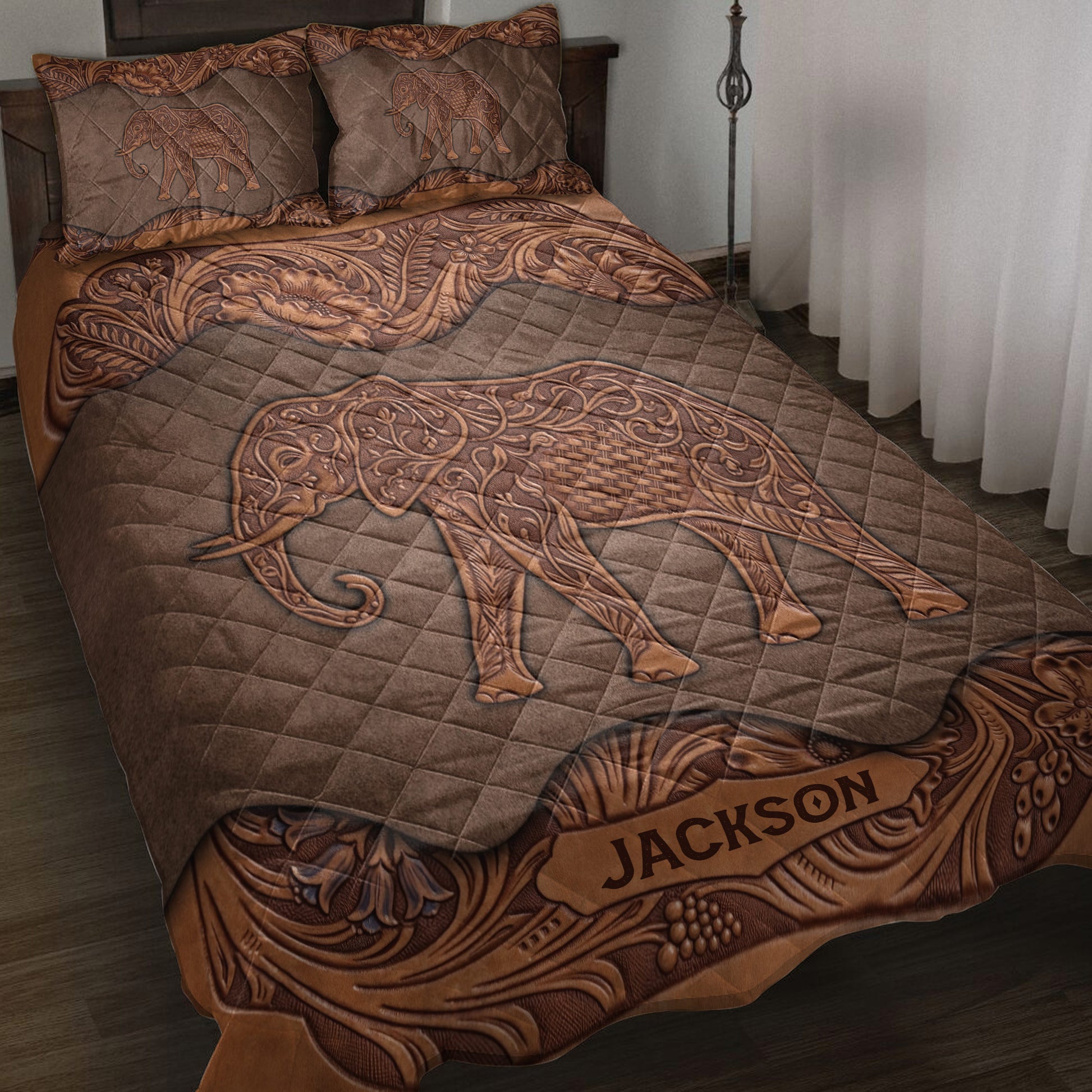 Brown elephant quilt blanket displayed on a bed with ornate floral paisley borders and matching elephant pillowcases