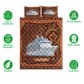 Cruise ship quilt bedding set shown with ornate brown artwork and soft, washable, colorfast feature icons