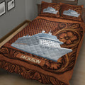 Close view of cruise ship quilt blanket with detailed ocean liner artwork and rich brown decorative patterns
