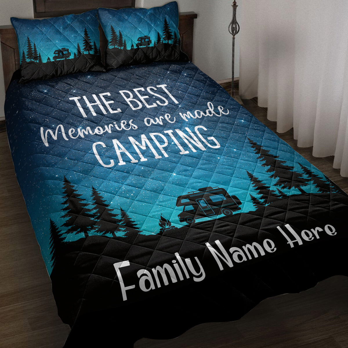 Camping quilt blanket on a bed with turquoise starry sky, pine trees, camper artwork, and family design theme