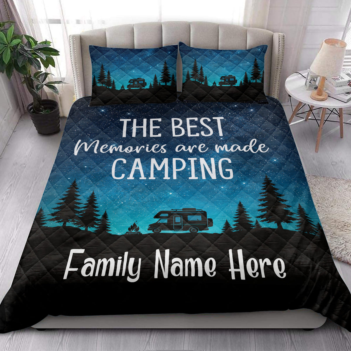 Camping quilt blanket styled on a bedroom bed with camper, forest, starry sky, and turquoise outdoor artwork