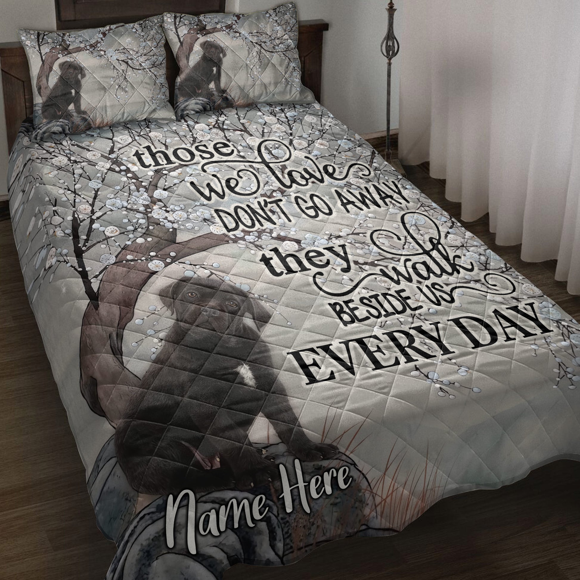 Cane Corso quilt blanket displayed on a bed with floral branches and a dark dog portrait