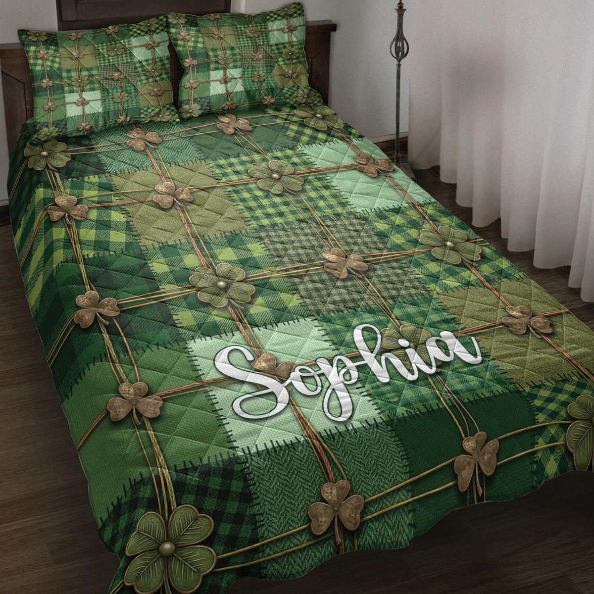 Irish quilt blanket displayed on a bed with green tartan patchwork and shamrock artwork