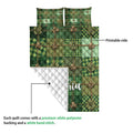 Irish quilt blanket detail showing printed green tartan front and white quilted backing