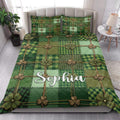 Irish green tartan quilt bedding styled in a bright bedroom with shamrock artwork