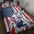 Hockey quilt bedding set displayed on a bed with goalie artwork and patriotic red, white, and blue stars and stripes