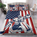 Hockey quilt bedding styled in a bright bedroom with goalie artwork and red, white, and blue patriotic design