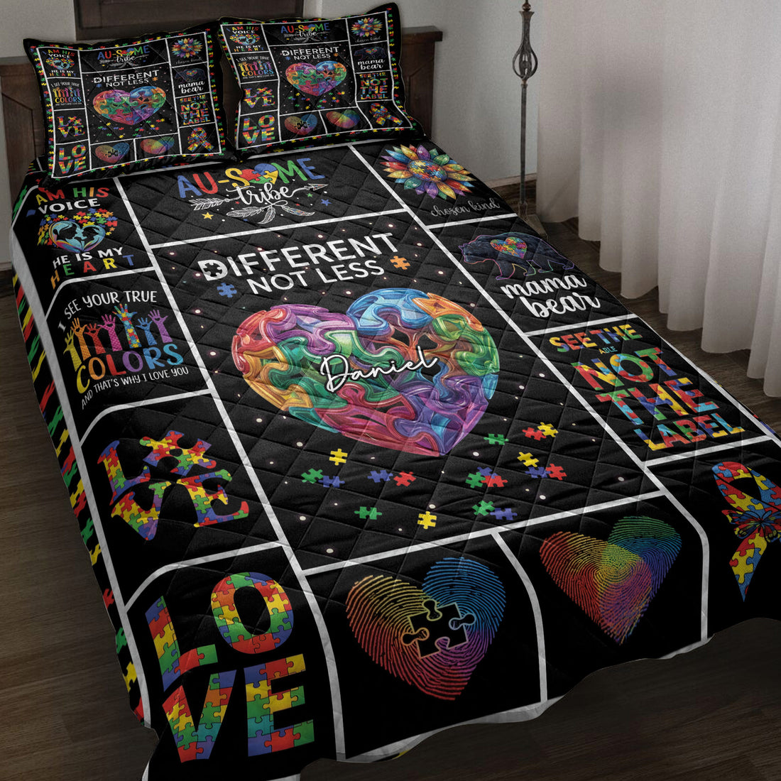 Autism awareness quilt blanket displayed on a bed with colorful puzzle-piece hearts and neurodiversity artwork