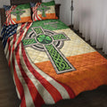 Irish quilt blanket displayed on a bed with Celtic cross artwork, shamrock motifs, and Irish-American colors