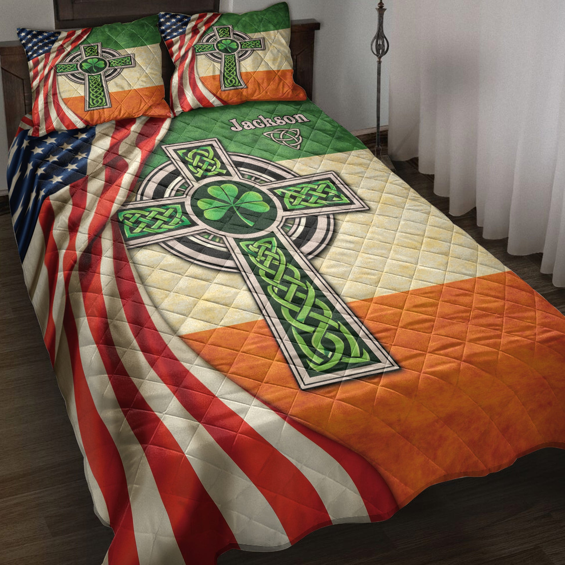 Irish quilt blanket displayed on a bed with Celtic cross artwork, shamrock motifs, and Irish-American colors
