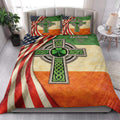 Irish quilt bedding set styled in a bright bedroom with Celtic cross and shamrock artwork