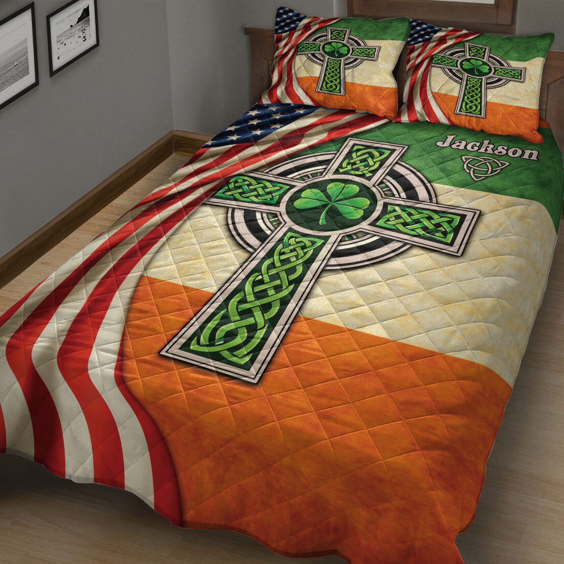 Close bedroom view of an Irish quilt blanket featuring Celtic knots, shamrocks, and Irish-American colors