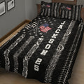 Motorsport quilt blanket shown on a bed with crossed racing flags, tire tread patterns, stars, and automotive graphics