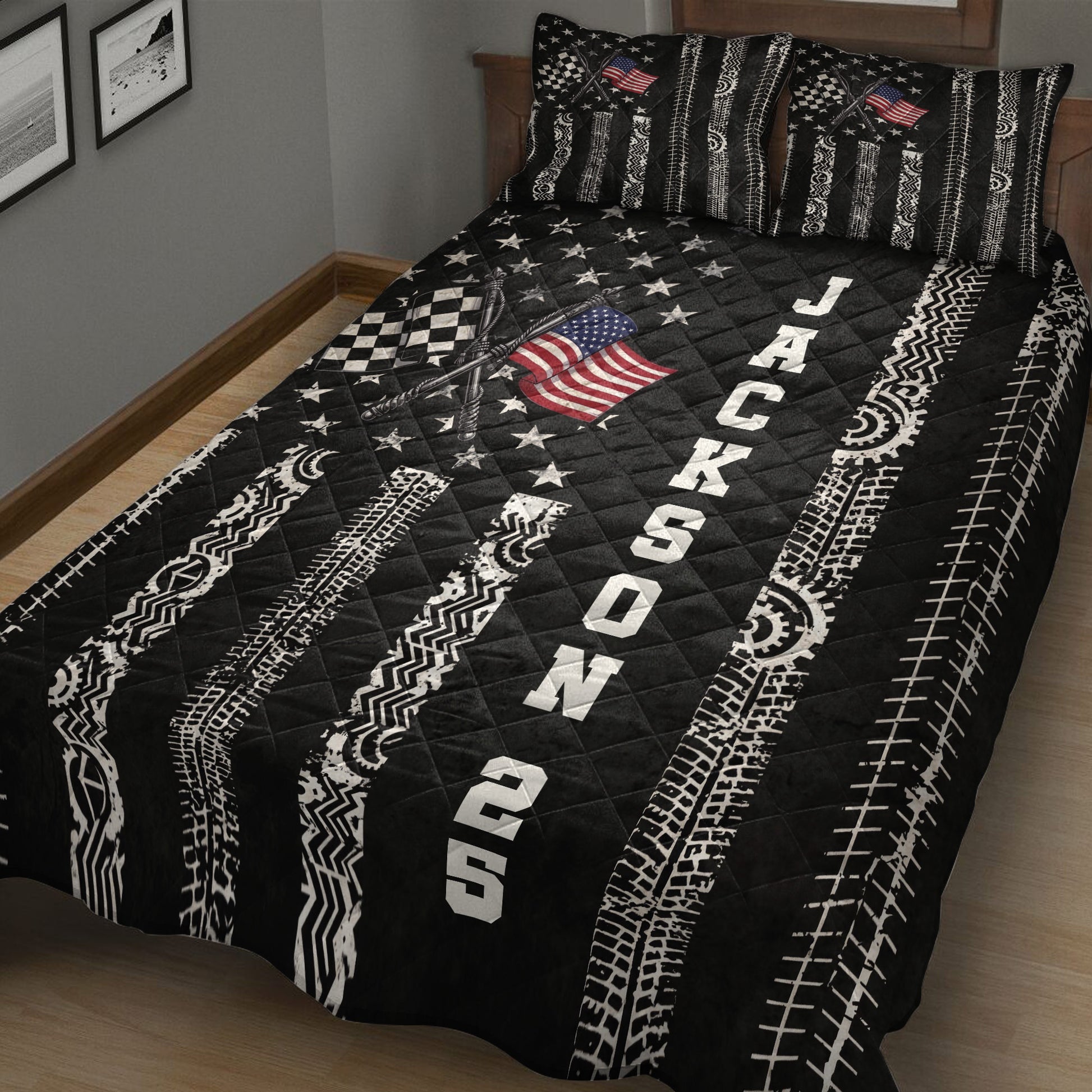 Motorsport quilt blanket shown on a bed with crossed racing flags, tire tread patterns, stars, and automotive graphics