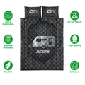 Camping quilt bedding set with dark travel trailer design shown with product feature icons